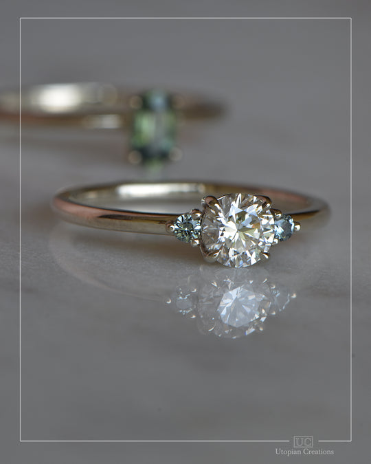 Helene — 0.60ct Lab Diamond and two Teal Sapphire - 9k White Gold