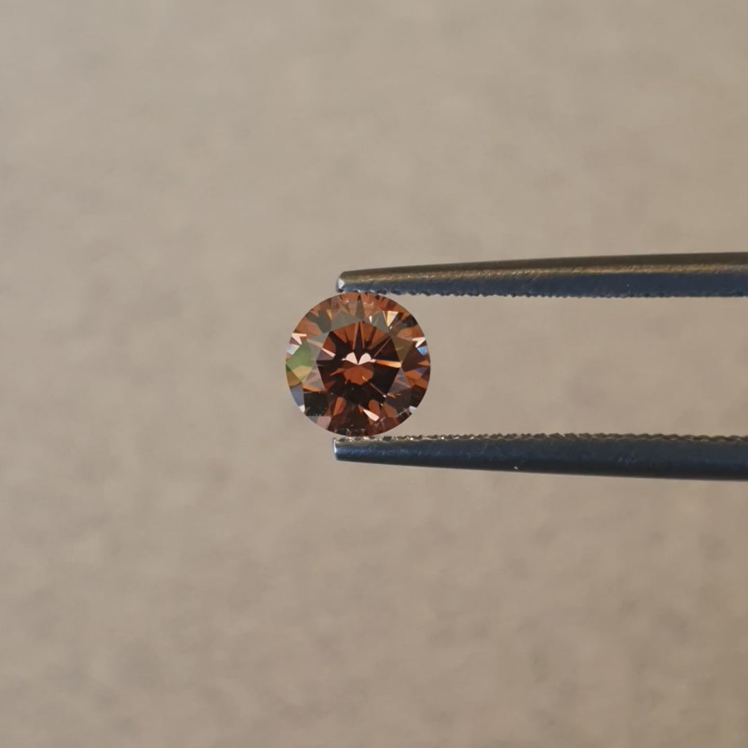 0.63ct Australian Cognac Argyle Diamond with flashes of Orange/Pink - Round