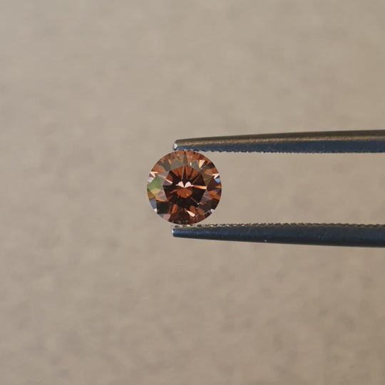 0.63ct Australian Cognac Argyle Diamond with flashes of Orange/Pink - Round